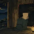 墨を重ねる堂の黒い板